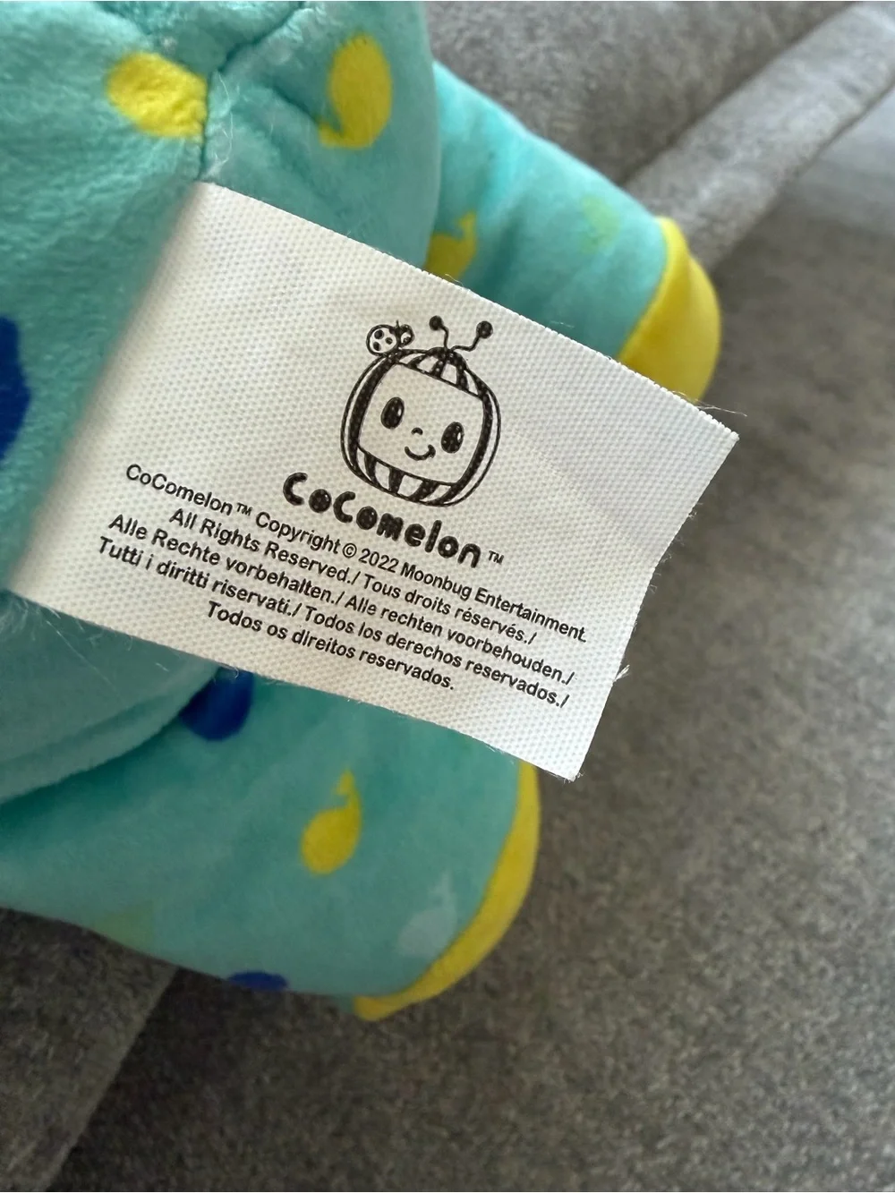 Cocomelon baby doll with blue/yellow duck pattern